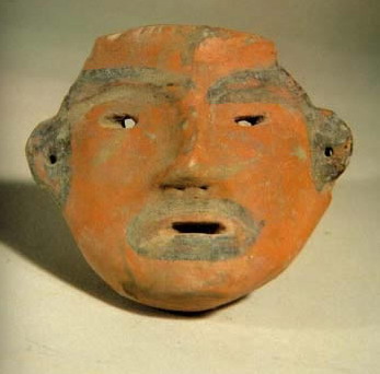 photo of Painted sculpture of a human face